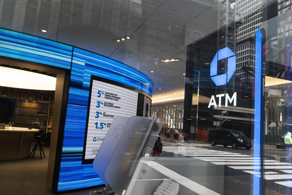 A Chase ATM is open, Wednesday, Jan. 13, 2021 in New York. JPMorgan Chase & Co., the nation’s largest bank by assets, said its fourth quarter profits jumped by 42% from a year earlier, as the firm’s investment bank division had a stellar quarter and the bank’s balance sheet improved despite the pandemic. (AP Photo/Mark Lennihan)