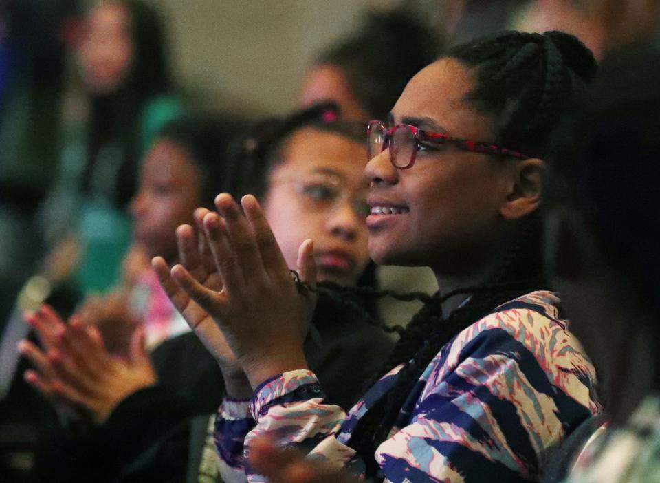 Dior Turner, 10, a fourth grader at Miller South School for the Visual and Performing Arts, claps for singer Serrin Joy during a performance Thursday at Miller South.