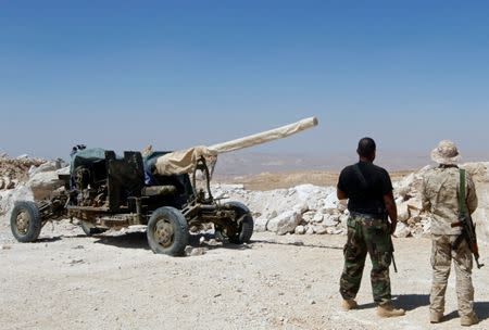 Hezbollah fighters are seen carrying their weapons in Juroud Arsal, Syria-Lebanon border, July 25, 2017. REUTERS/Mohamed Azakir