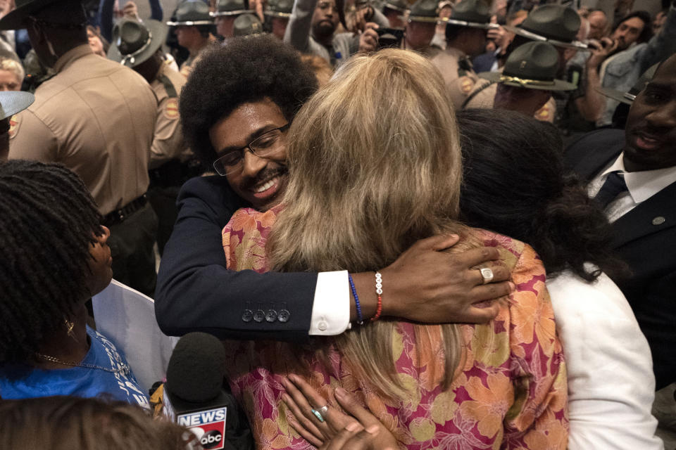 Former Rep. Justin Pearson, D-Memphis, left, Rep. Gloria Johnson, center, D-Knoxville, and former Rep. Justin Jones, D-Nashville, right, outside the House chamber after Pearson and Jones were expelled from the Legislature