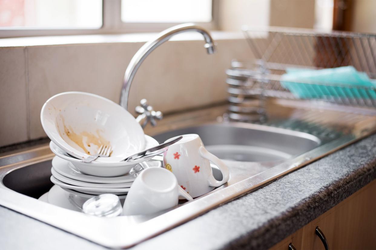 Dishes piled in sink