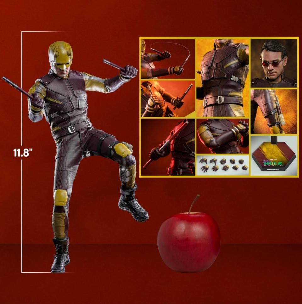 Hot Toys Daredevil with his yellow and red She-Hulk costume and an apple showing scale