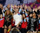 Beyonce (L), Chris Martin (C) and Bruno Mars perform during the half-time show at the NFL's Super Bowl 50 between the Carolina Panthers and the Denver Broncos in Santa Clara, California February 7, 2016. REUTERS/Mike Blake