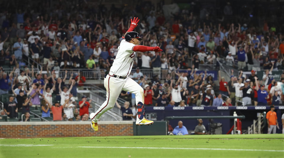 Atlanta Braves second baseman Orlando Arcia gets some air and the fans go wild as he hits a walk off single to beat the San Francisco Giants 2-1 during the ninth inning of a baseball game on Monday, June 20, 2022, in Atlanta. (Curtis Compton/Atlanta Journal-Constitution via AP)