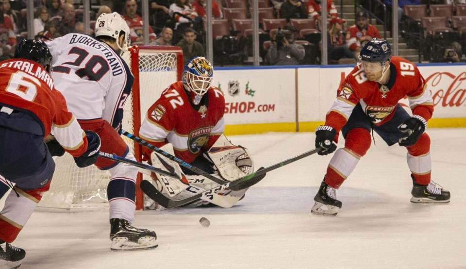 Columbus Blue Jackets right wing Oliver Bjorkstrand (28) fails to score as Florida Panthers goaltender Sergei Bobrovsky (72) and defenseman Mike Matheson (19) defend the goal in the first period as the Florida Panthers host the Columbus Blue Jackets at the BB&T Center in Sunrise on Saturday, December 7, 2019.