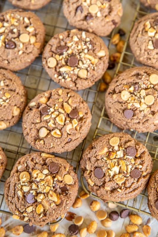 <p>Plain Chicken</p><p>You've never had a chocolate chip cookie like this! These are loaded with chocolate chips, peanut butter chips and honey-roasted peanuts.</p><p><strong>Get the recipe: <a href="https://www.plainchicken.com/chocolate-peanut-butter-chocolate-chip/" rel="nofollow noopener" target="_blank" data-ylk="slk:Chocolate Peanut Butter Chocolate Chip Cookies;elm:context_link;itc:0;sec:content-canvas" class="link ">Chocolate Peanut Butter Chocolate Chip Cookies</a></strong></p>