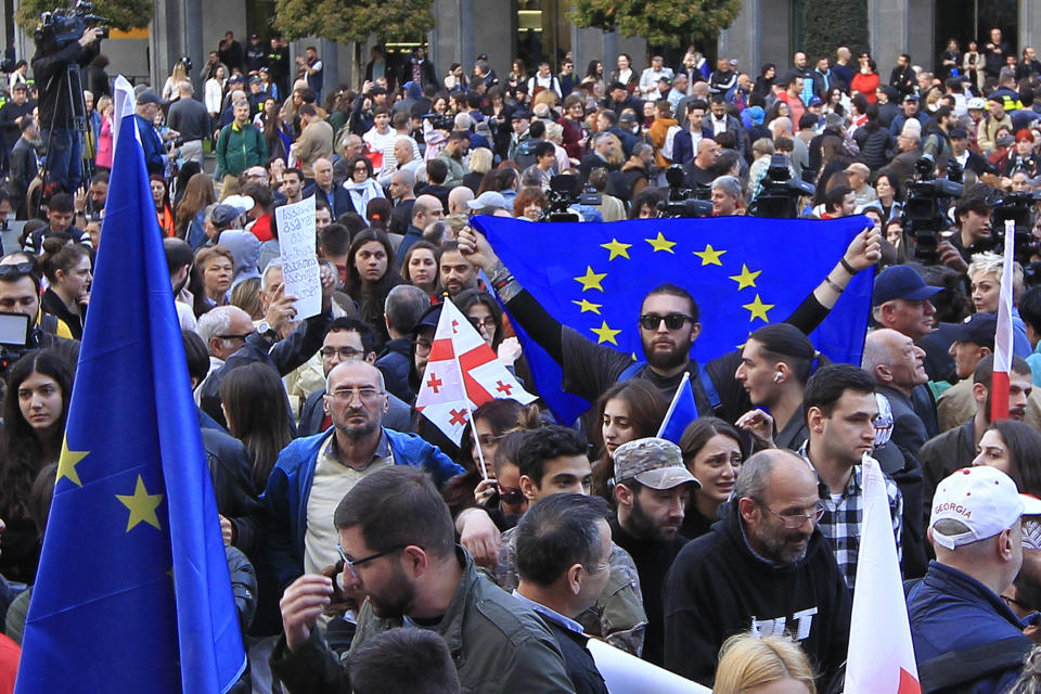 Protestors gather outside the parliament building in Tbilisi, Georgia, on Monday, April 15, 2024, to protest against the "the Russian law" similar to a law that Russia uses to stigmatize independent news media and organizations seen as being at odds with the Kremlin. (AP Photo/Shakh Aivazov)