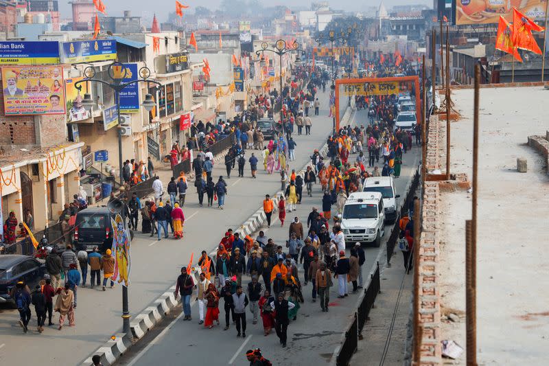 Hindu devotees walk towards the Hindu god Lord Ram temple after its inauguration in Ayodhya