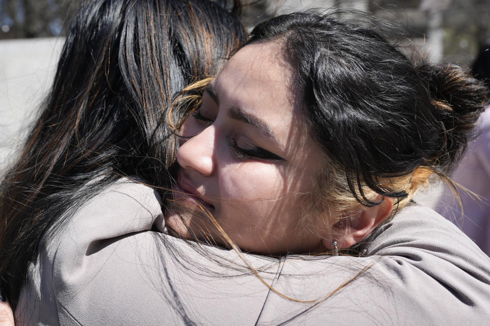 Joanna Maldonado, right, receives a hug after speaking during a news conference of the Tennessee Immigrant and Refugee Rights Coalition outside the state Capitol, Tuesday, March 19, 2024, in Nashville, Tenn. Members of the group came to the state Capitol to lobby legislators to vote against legislation that require local law-enforcement agencies to operate as if they have federal 287(g) agreements and a bill criminalizing transportation of undocumented immigrants. (AP Photo/George Walker IV)