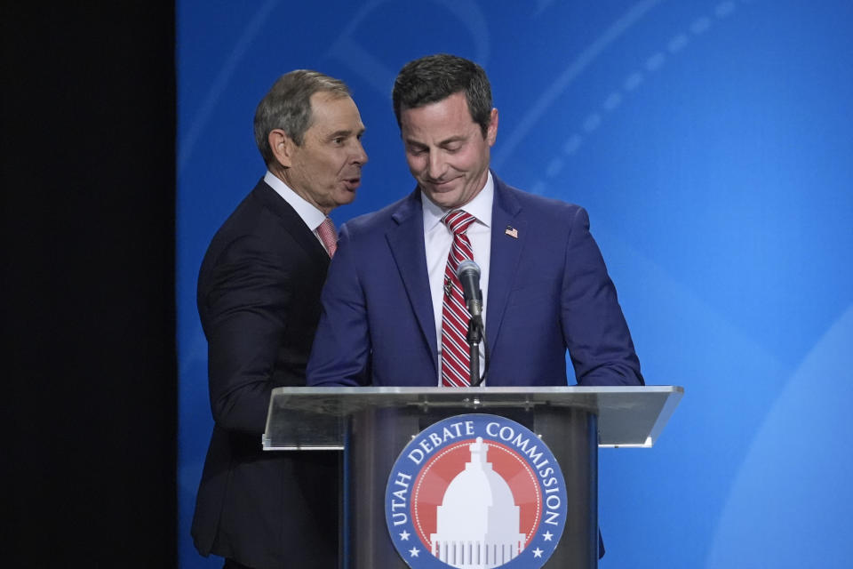 FILE - U.S. Rep. John Curtis, left, reacts to a statement made by Trent Staggs, right, following the Utah Senate primary debate for Republican contenders battling to win the seat of retiring U.S. Sen. Mitt Romney on June 10, 2024, in Salt Lake City. Curtis, who is considered the front-runner, has pitched himself as the alternative to Trump-backed Riverton Mayor Staggs and two other contenders, who have spent much of the race arguing over whose policy positions most closely align with Trump's. (AP Photo/Rick Bowmer, Pool, File)