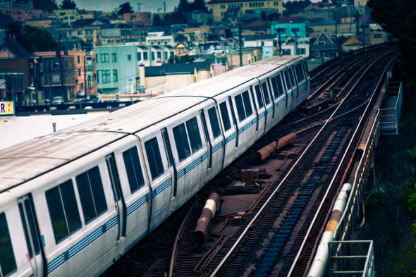 A 10-car Bay Area Rapid Transit train passes over a section of elevated track on it's way to San Francisco