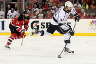 NEWARK, NJ - JUNE 09: Justin Williams #14 of the Los Angeles Kings shoots and scores in the second period against the New Jersey Devils during Game Five of the 2012 NHL Stanley Cup Final at the Prudential Center on June 9, 2012 in Newark, New Jersey. (Photo by Elsa/Getty Images)