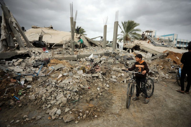 Palestinians inspect the destruction caused by Israeli airstrikes on their homes in the Khuza'a area, in Khan Yunis, Gaza, on Monday. Photo by Ismail Muhammad/UPI