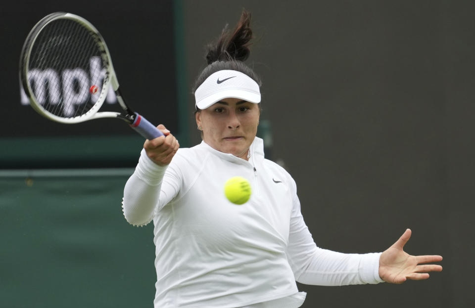 Canada's Bianca Andreescu plays a return to Alize Cornet of France during the women's singles first round match on day three of the Wimbledon Tennis Championships in London, Wednesday June 30, 2021. (AP Photo/Alberto Pezzali)