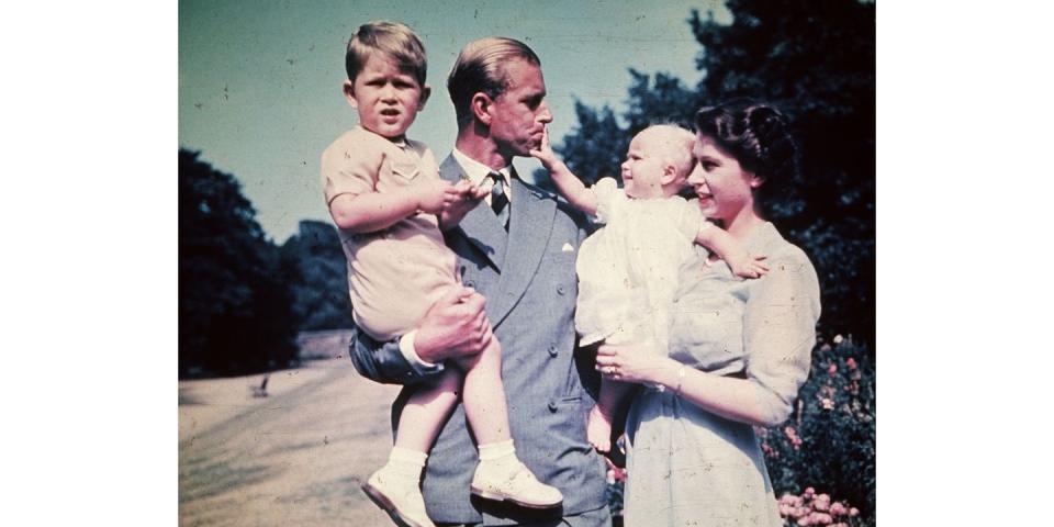 <p>Princess Anne looked elated to be in her mother's embrace as she adorably put her hand on Prince Philip's face. </p>