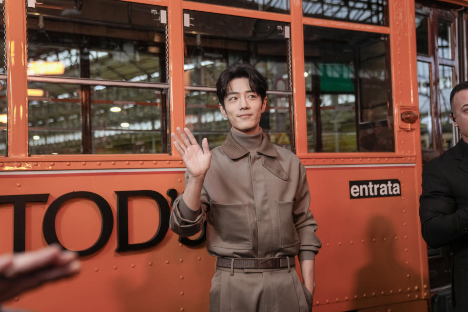 Chinese actor and singer Xiao Zhan poses for photos as he arrives for the unveiling of the Tod's women's Fall-Winter 2024-25 collection in Milan, Italy, Friday, Feb. 23, 2024. (AP Photo/Luca Bruno)