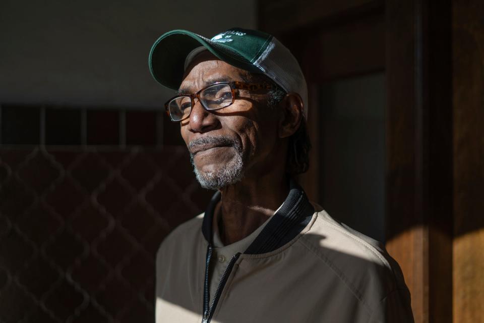 Anthony Patterson, 64, of Detroit, stands in the entrance to his apartment complex in Detroit on Monday, Nov. 14, 2022. Patterson smoked for years, but had never been screened for lung cancer. Two years ago, a CT scan found a nodule that turned out to be cancerous in his lung.