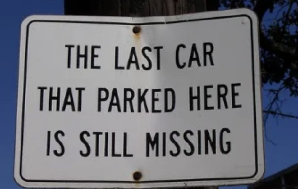 A sign reads: "The last car that parked here is still missing."