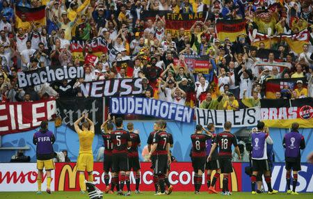 Germany's national soccer players acknowledge their fans after their win over the U.S. at the end of their 2014 World Cup Group G soccer match at the Pernambuco arena in Recife June 26, 2014. REUTERS/Yves Herman