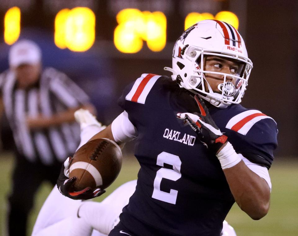 Oakland's Jordan James (2) runs the ball during the Class 6A TSSAA BlueCross Bowl Championship game against Summit, on Saturday, Dec. 4, 2021, in Chattanooga.