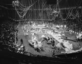<p>Gaily costumed circus performers and animals dance their way over the Madison Square Garden tanbark in a Celestial Calendar Cavalcade, during rehearsal in New York, March 30, 1955, for opening of the 1955 edition of Ringling Brothers and Barnum and Bailey Circus. The cavalcade is one of 26 displays in the show which starts its annual tour with the current New York booking. (AP Photo/Matty Zimmerman) </p>