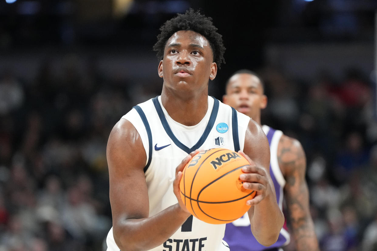 INDIANAPOLIS, INDIANA - MARCH 22:  Great Osobor #1 of the Utah State Aggies takes a foul shot during the NCAA Men's Basketball Tournament - First Round game against the TCU Horned Frogs at Gainbridge Fieldhouse on March 22, 2024 in Indianapolis, Indiana.  (Photo by Mitchell Layton/Getty Images)