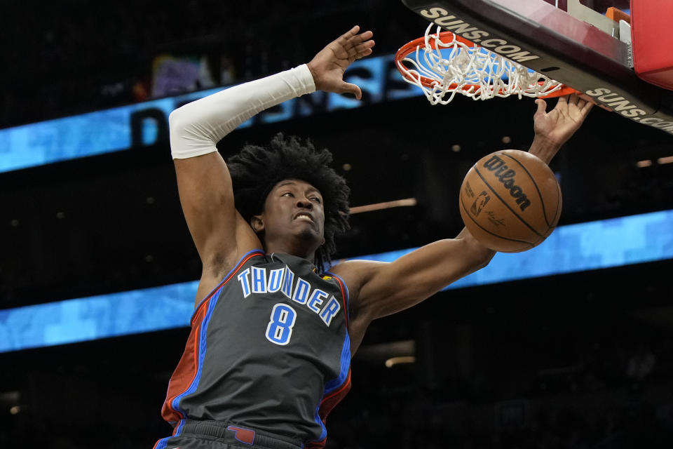 Oklahoma City Thunder forward Jalen Williams dunks against the Phoenix Suns during the first half of an NBA basketball game, Friday, Feb. 24, 2023, in Phoenix. (AP Photo/Rick Scuteri)