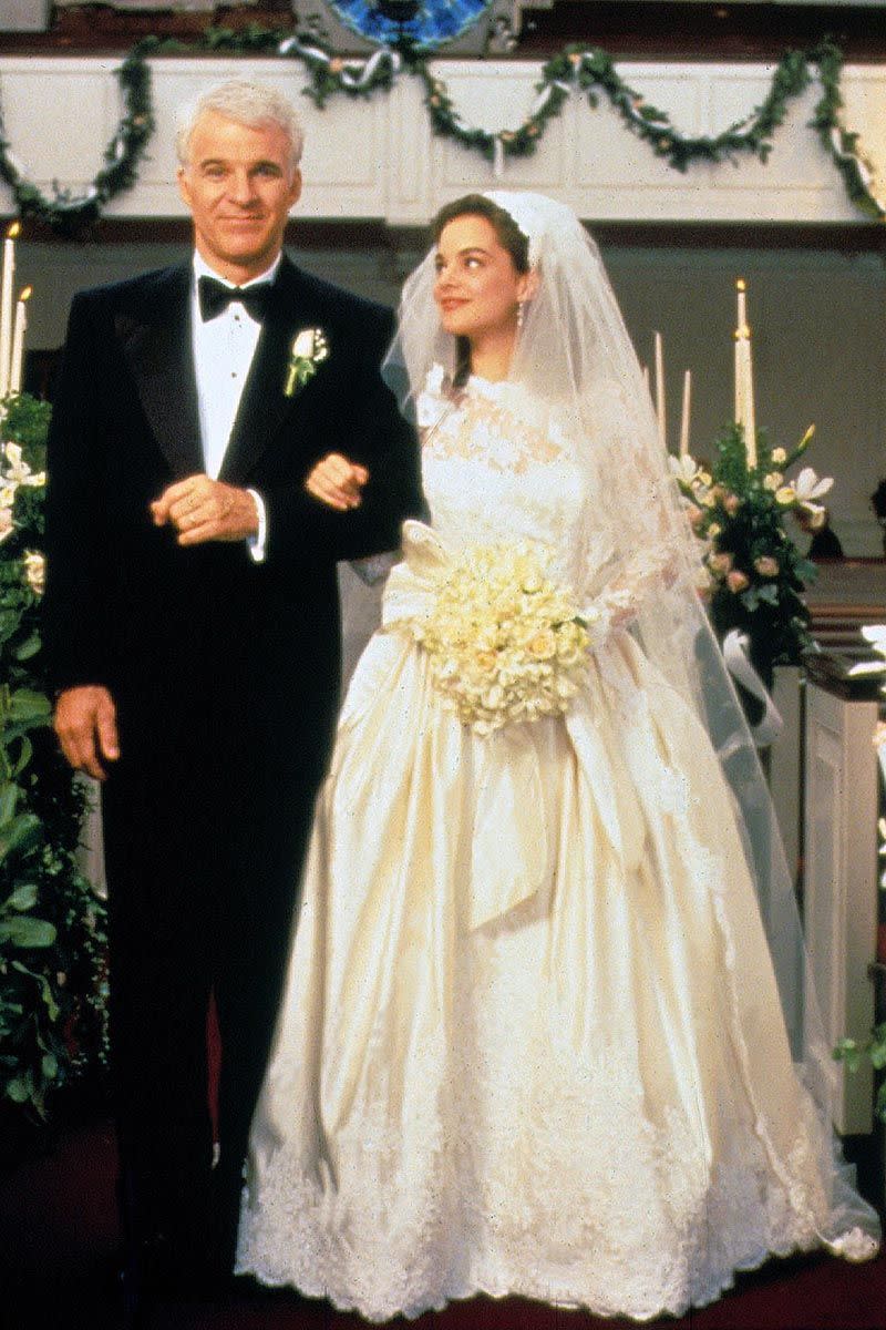 <p>George Banks may have lost his little girl, but at least we were all able to lust over the dreamy silk-and-lace gown that Kimberly Williams-Paisley wore as Annie Banks. In typical '90s fashion, the bride opted for a full skirt and lots of luxe details.<br></p>