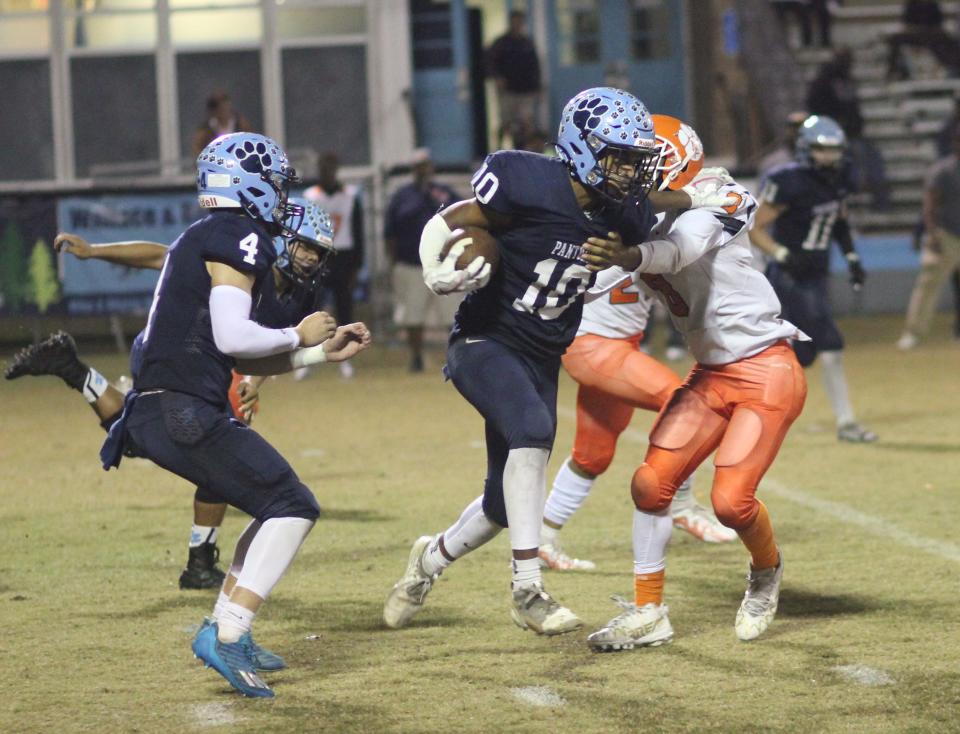 East Duplin's Nizaya Hall finds running room in a first-round win over North Pitt.