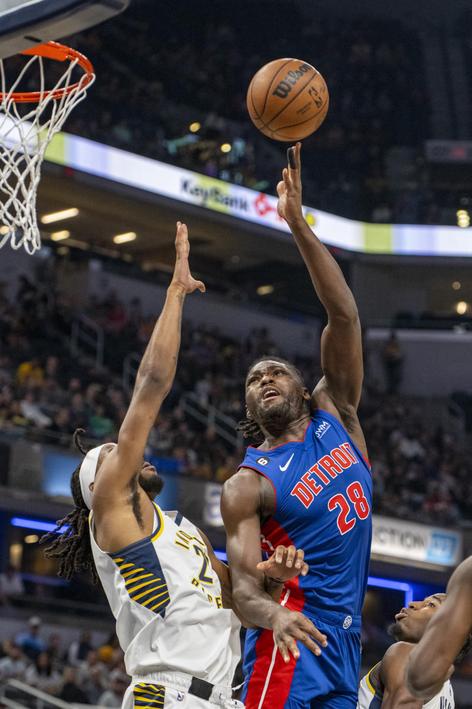 Detroit Pistons center Isaiah Stewart (28) shoots over Indiana Pacers forward Isaiah Jackson (22) during the first half of an NBA basketball game in Indianapolis, Saturday, Oct. 22, 2022. (AP Photo/Doug McSchooler)