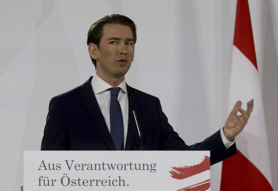 Sebastian Kurz head of the Austrian People's Party, OEVP, speaks to journalists during a press conference about the government program with Werner Kogler head of the Austrian Greens in Vienna, Austria, Thursday, Jan. 2, 2020. The banner reads "To responsibility for Austria". (AP Photo/Ronald Zak)