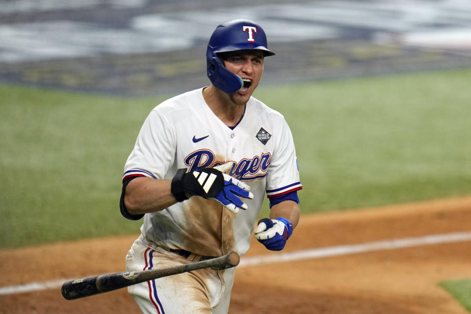 Texas Rangers' Corey Seager celebrates after hitting a two-run home run against the Arizona Diamondbacks during the ninth inning in Game 1 of the baseball World Series Friday, Oct. 27, 2023, in Arlington, Texas. (AP Photo/Julio Cortez)