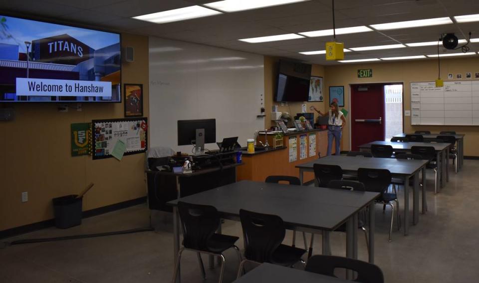 Gladys Martinez, a new teacher in a new science classroom at Hanshaw Middle School, prepares to welcome students on the first day of school for Modesto City Schools, Monday, Aug. 8, 2022.