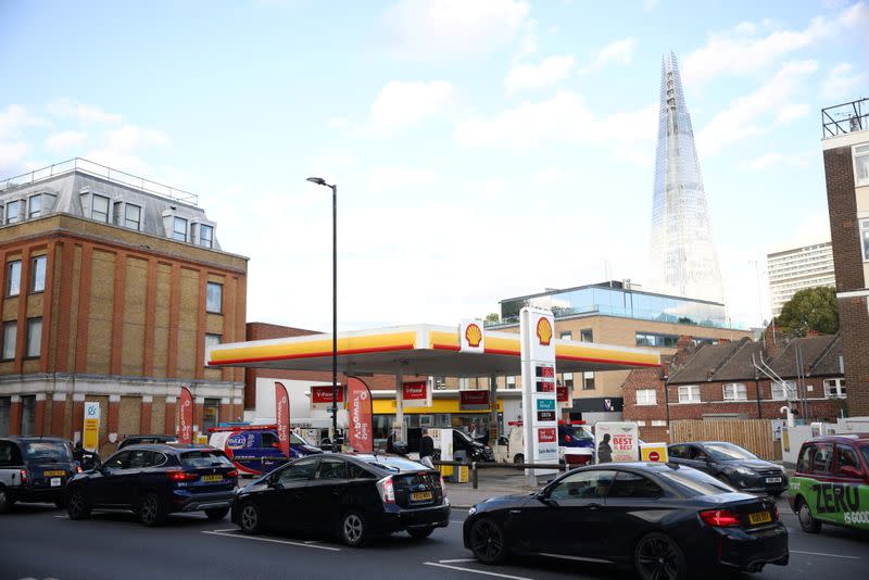 Vehicles queue to refill at a Shell fuel station in central London