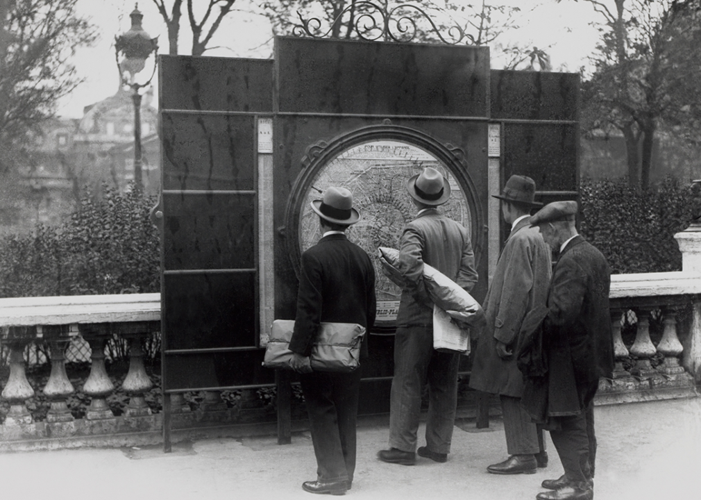 Pedestrians looking at street map.