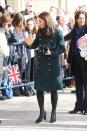 <p>Duchess Kate wore a green Dolce & Gabbana coat with black tights and Tod's pumps for a visit to Sunderland with Prince William. Under her chic coat, the Duchess wore a printed dress by Seraphine, one of her favorite maternity brands.</p>