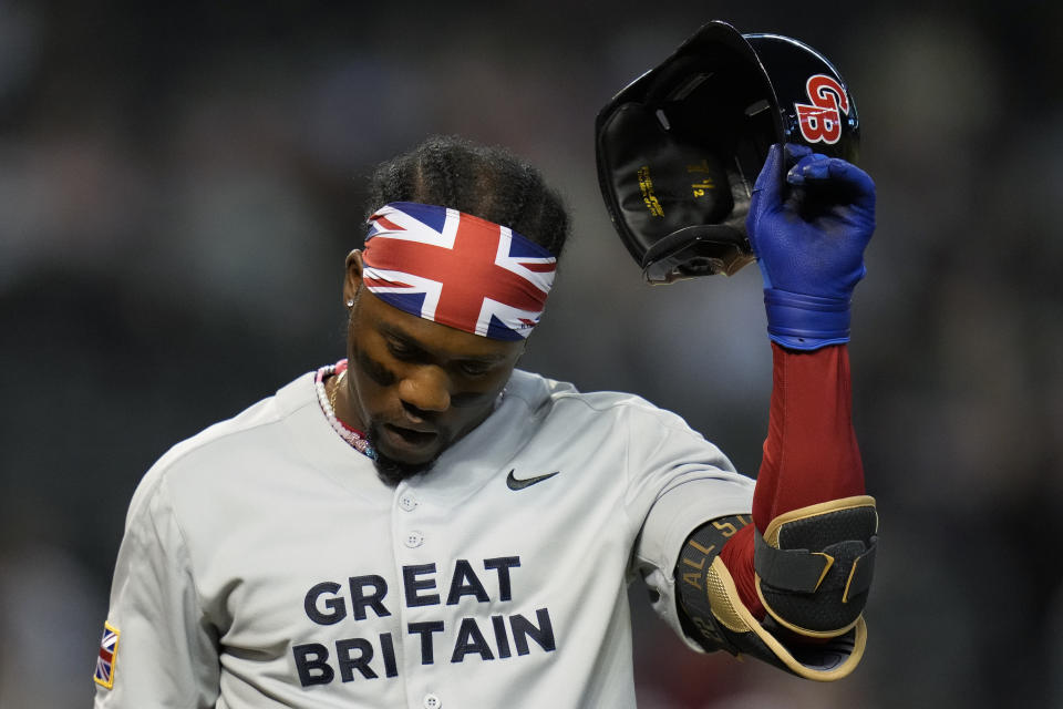Great Britain's Anfernee Seymour walks to the dugout after striking out against Canada during the third inning of a World Baseball Classic game in Phoenix, Sunday, March 12, 2023. (AP Photo/Godofredo A. Vásquez)