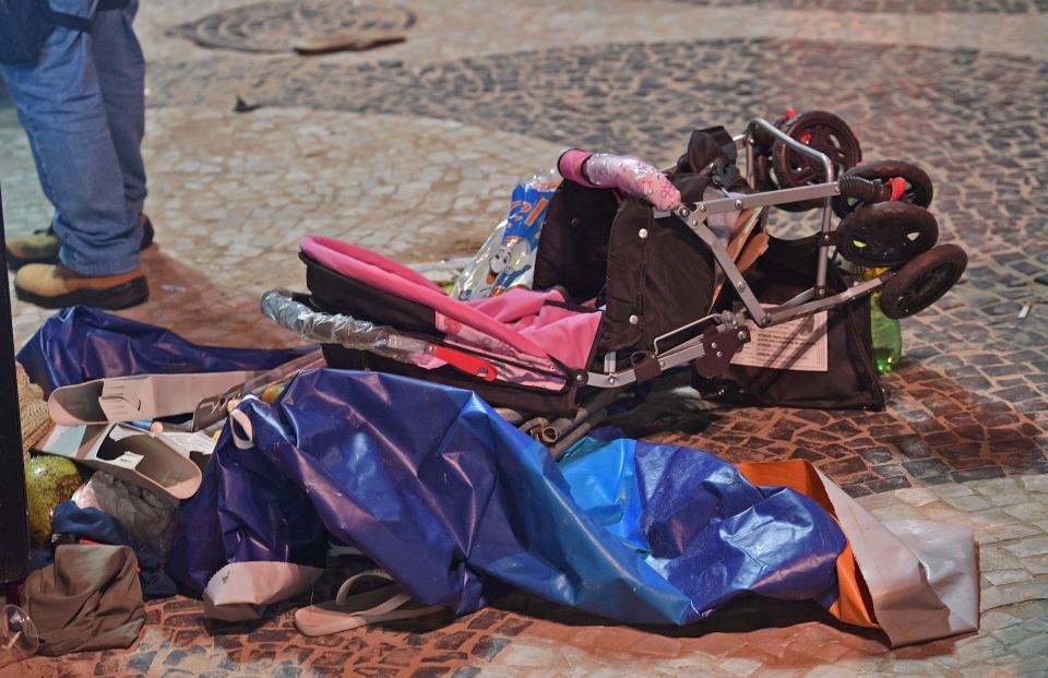 <p>A discarded pram is seen at the scene of a car crash at Copacabana beach in Rio de Janeiro on (Photo: Carl de Souza/AFP/Getty Images) </p>