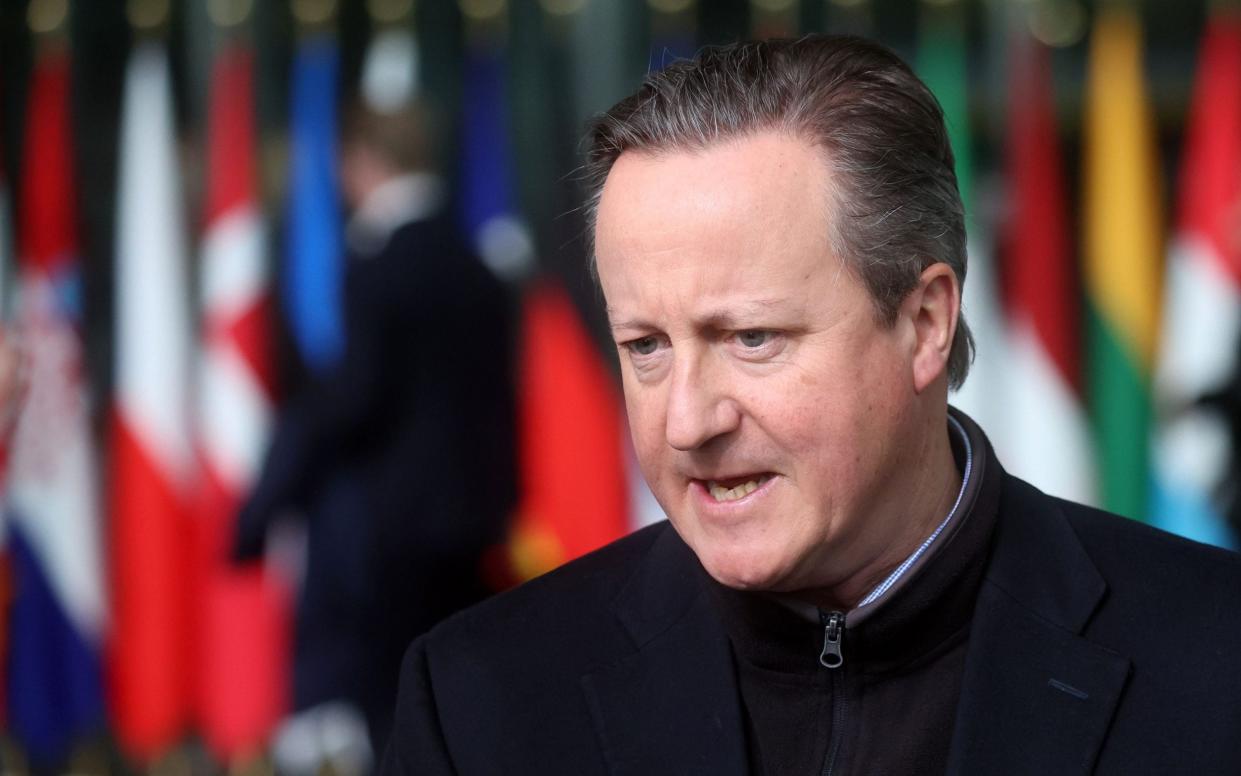 British Foreign Secretary David Cameron speaks to the media during a North Atlantic Treaty Organization (NATO) Foreign Affairs Ministers meeting in Brussels, Belgium