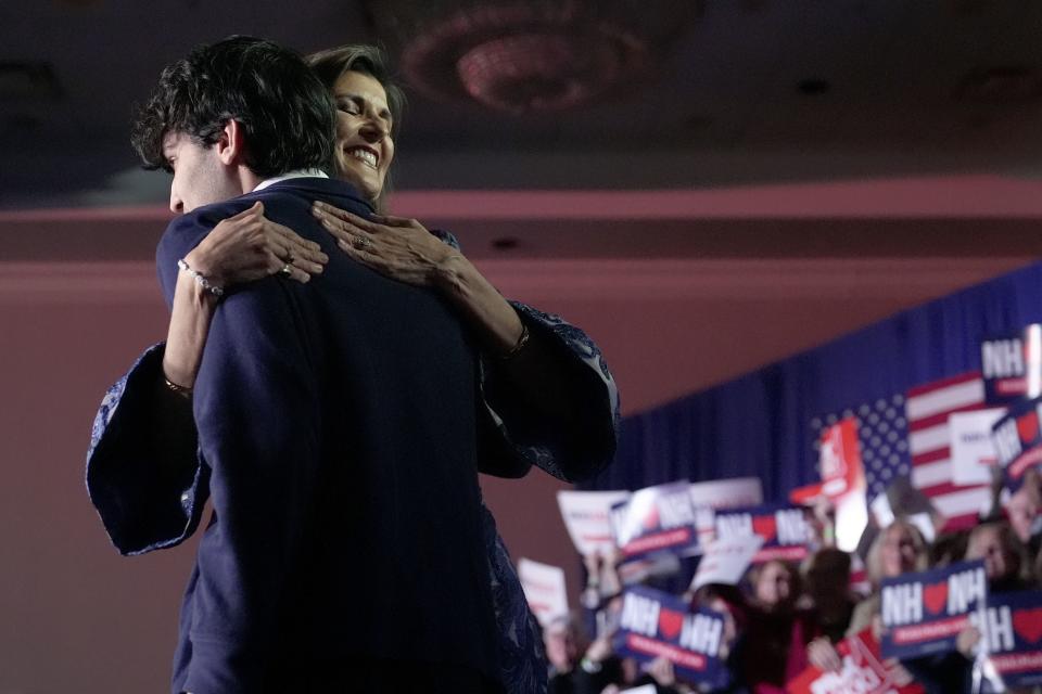 Republican presidential candidate and former U.N. ambassador Nikki Haley, left, hugs her son Nalin Haley at a New Hampshire primary night rally in Concord, N.H., Tuesday, Jan. 23, 2024. | Charles Krupa, Associated Press