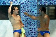 DELHI, INDIA - OCTOBER 12: Reuben Ross and Alexandre Despatie of Canada celebrate after winning the gold medal in the Men's 3m Synchro Springboard Final at Dr. S.P. Mukherjee Aquatics Complex on day nine of the Delhi 2010 Commonwealth Games on October 12, 2010 in Delhi, India. (Photo by Feng Li/Getty Images)