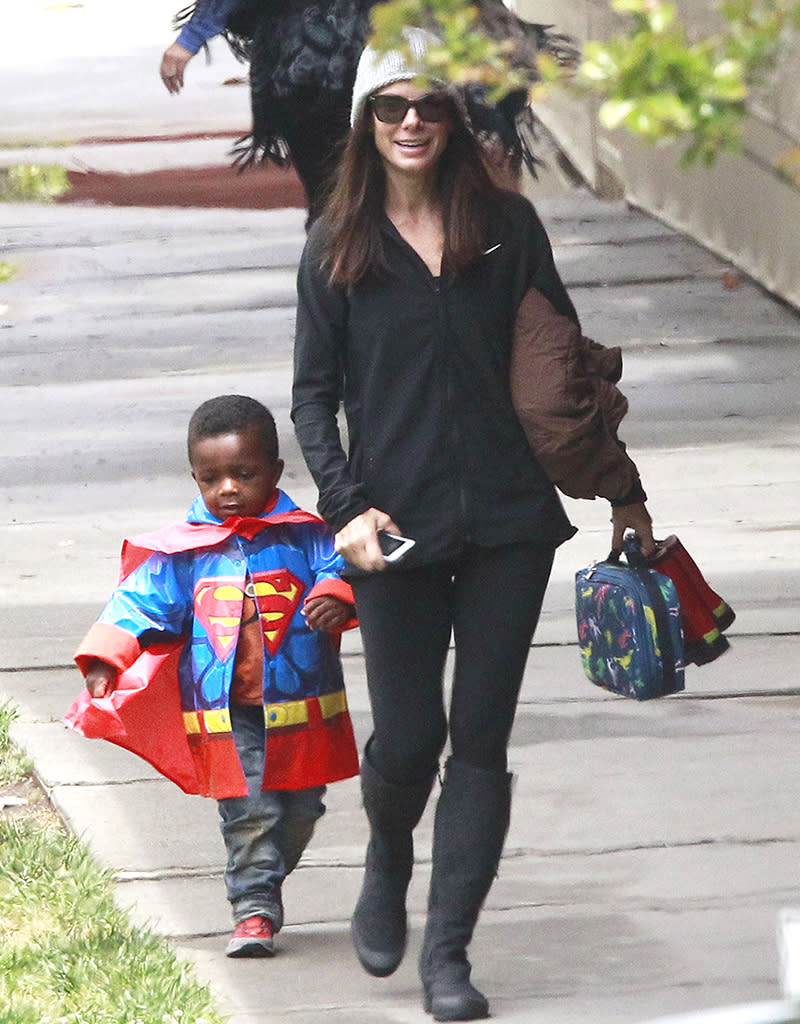 Sandra Bullock Picks Up Her Mini Superman