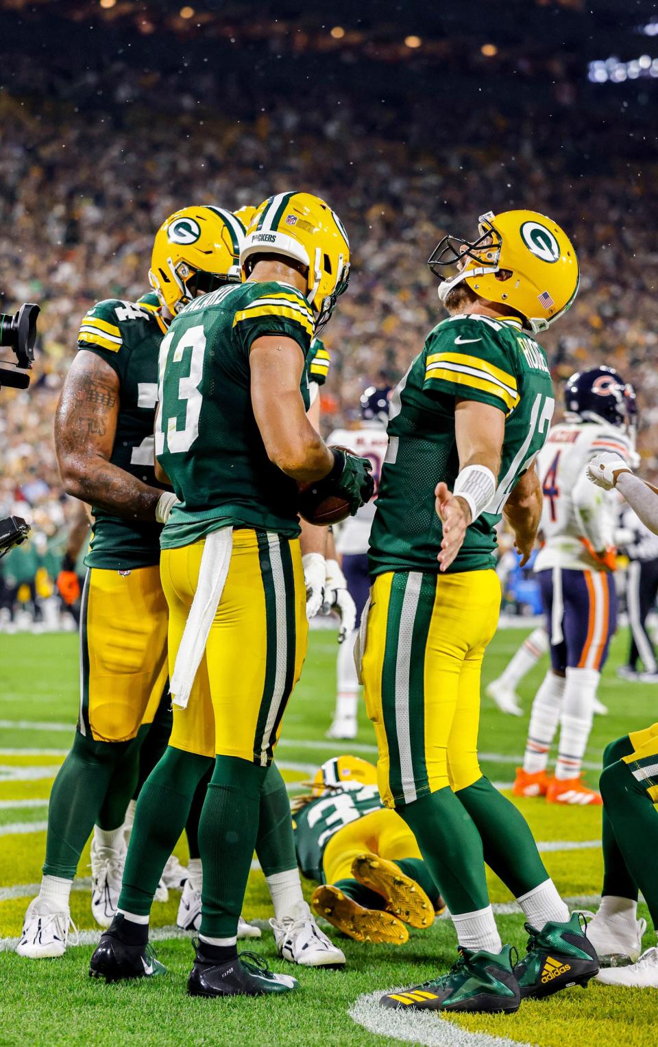 Aaron Rodgers and Allen Lazard celebrate a touchdown against the Chicago Bears.