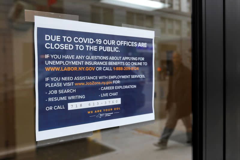 Signage is seen posted on the entrance of the New York State Department of Labor offices, which closed to the public due to the coronavirus disease (COVID-19) outbreak in the Brooklyn borough of New York City