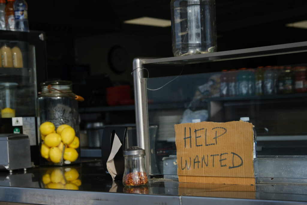 A help wanted sign is displayed at a boardwalk restaurant the day before the Memorial Day weekend in the shore community of Wildwood on May 28, 2021, in Wildwood, New Jersey.(Spencer Platt/Getty Images)