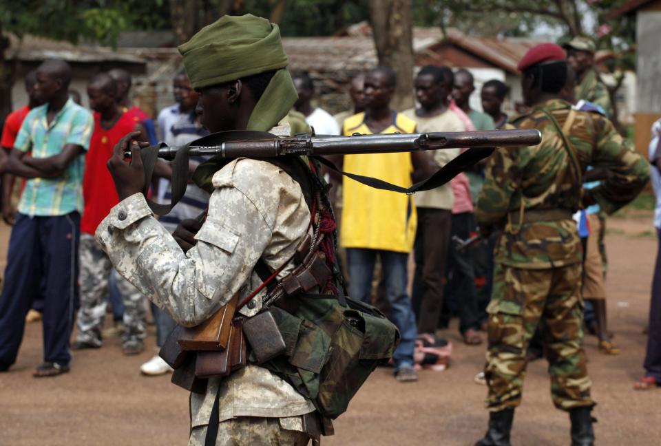 A Chad soldier holds his weapon in Bangui December 9, 2013. French troops in Central African Republic clashed with gunmen in the capital Bangui on Monday as they searched for weapons in an operation to disarm rival Muslim and Christian fighters responsible for hundreds of killings since last week. REUTERS/Emmanuel Braun (CENTRAL AFRICAN REPUBLIC - Tags: POLITICS CIVIL UNREST CONFLICT MILITARY)