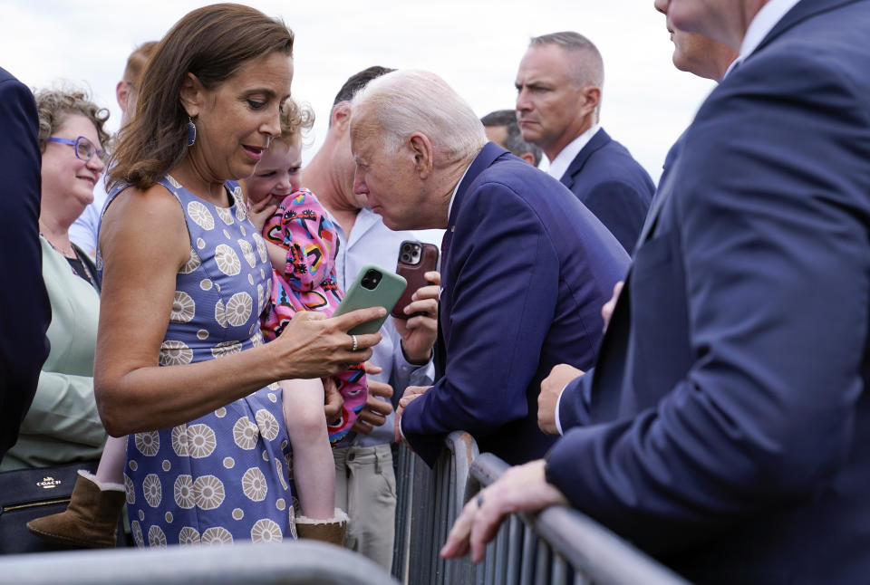 President Joe Biden talks to a child as he greets embassy staff members and their families before boarding Air Force One at Helsinki-Vantaan International Airport in Helsinki, Finland, Thursday, July 13, 2023. Biden is returning to Washington after meeting with Nordic leaders in Helsinki and attending the NATO Summit in Vilnius, Lithuania. (AP Photo/Susan Walsh)