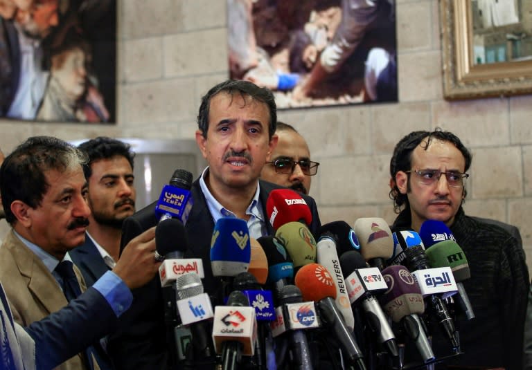 Huthi rebel delegation member Jalal al-Ruwaishan (C) speaks to reporters in Sanaa after returning from the peace talks