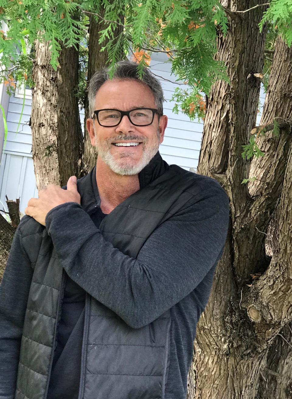 Tom Ernsting, 60, lives part of the year at his home in South Haven, Michigan. He's worked to build a social media presence but has seen scammers steal his image to use in romance scams.