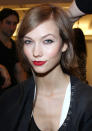 <b>Behind-the-scenes at Oscar de la Renta's AW13 New York Fashion Week show<br><br></b>A model raises a carefully-tweezed eyebrow as she shows off her perfectly-applied red lips backstage.<br><b><br></b>©Rex